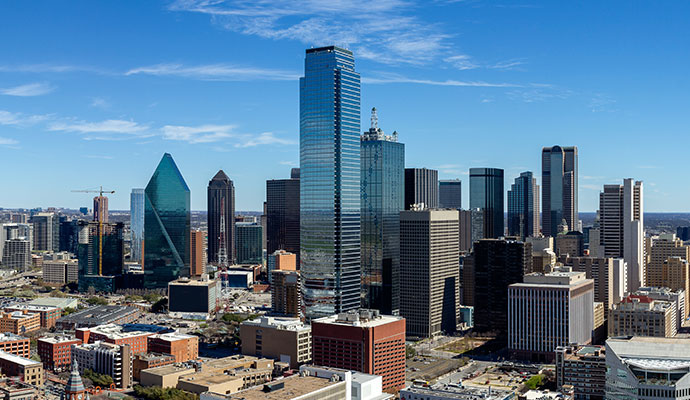 A skyline view of a downtown area filled with modern commercial buildings