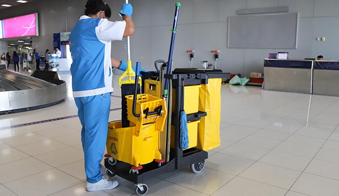 Janitor with a cleaning cart