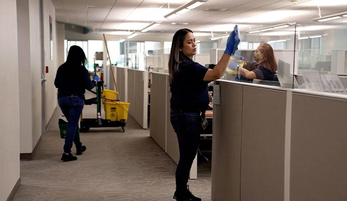 Professional team cleaning office