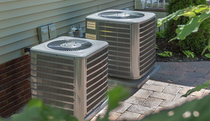 Two outdoor HVAC units installed side by side