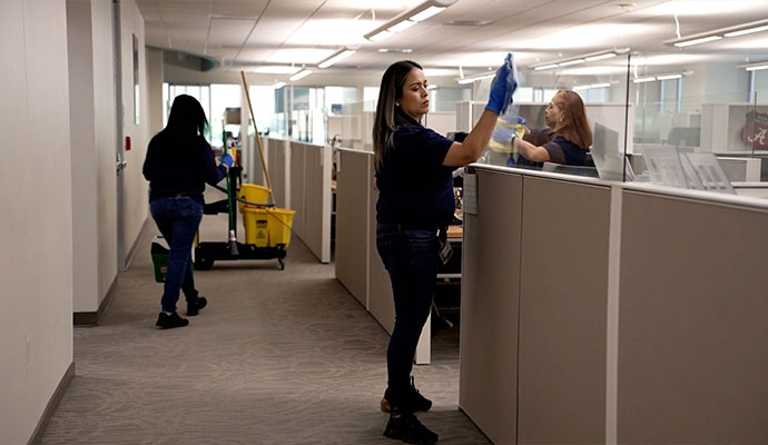 A professional team cleaning office space